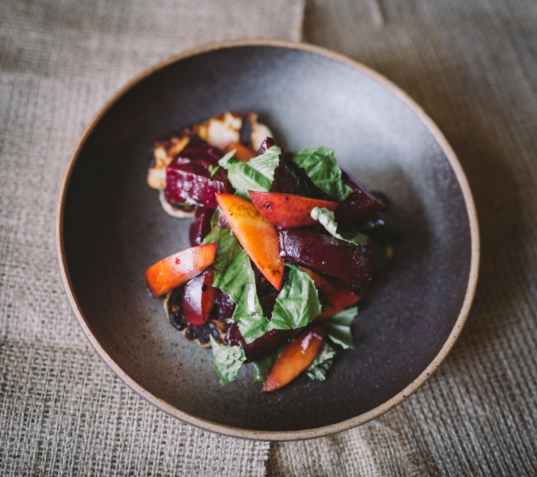 Grilled beets with peach, halloumi, and basil at Field & Vine